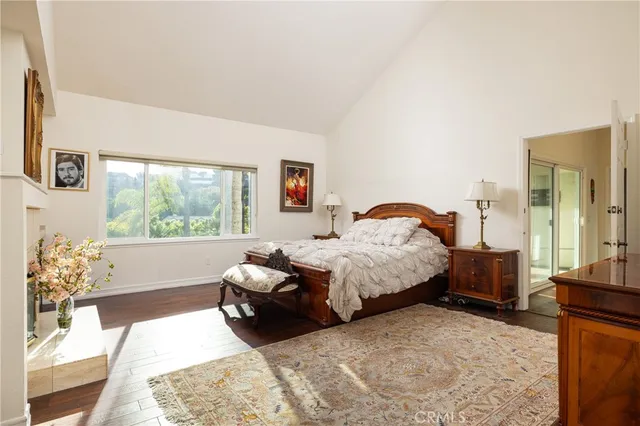 a bathroom with a granite countertop sink toilet a large mirror a shower and a bathtub