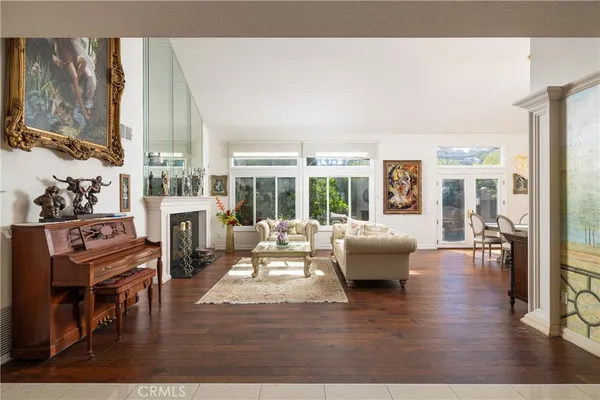 a living room with fireplace furniture and a flat screen tv