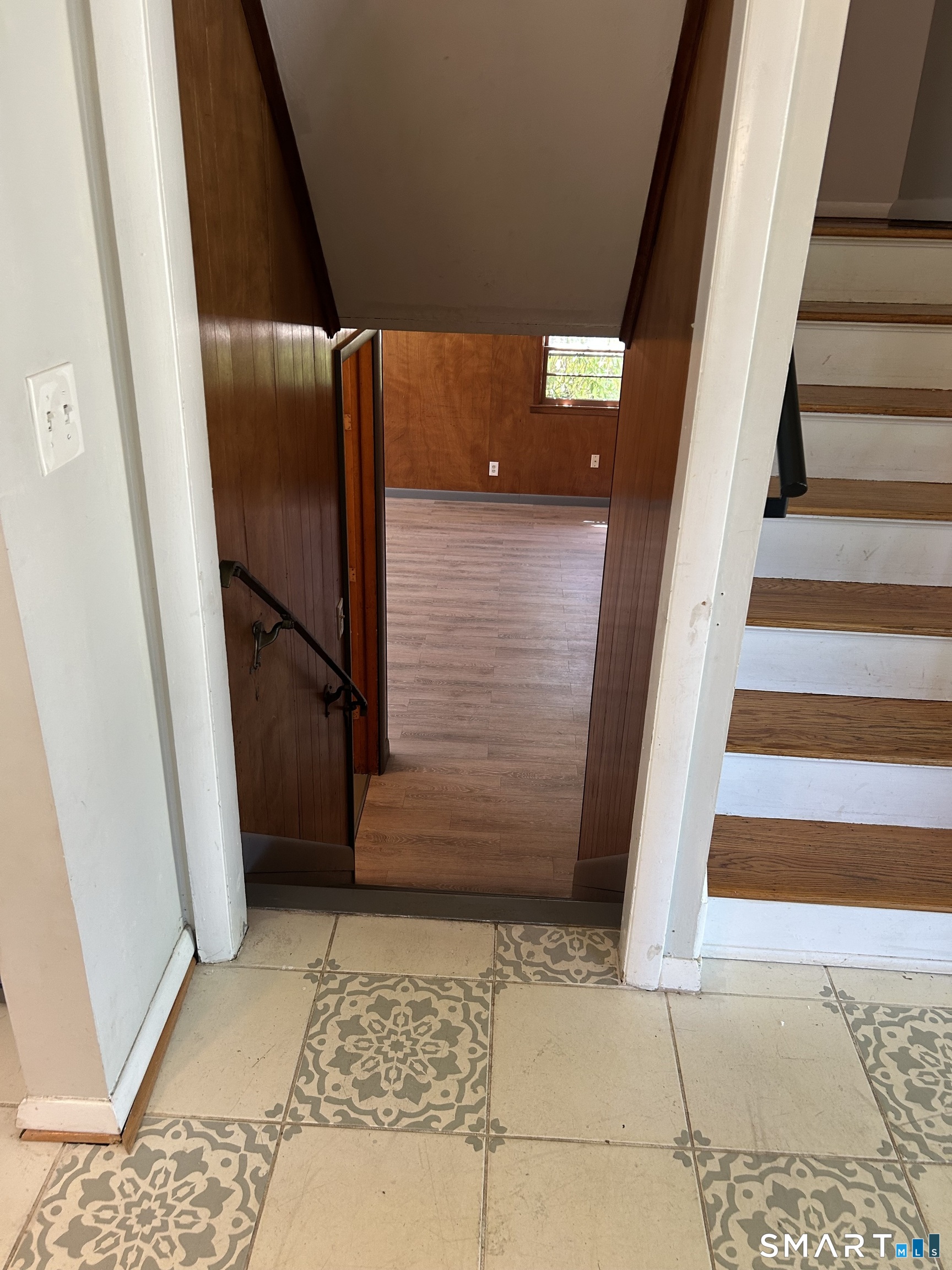 99 Lyman Road West Hartford, CT 06117 - Photo 32 of 39 Going up to the bedrooms and stairs going down to the family room.