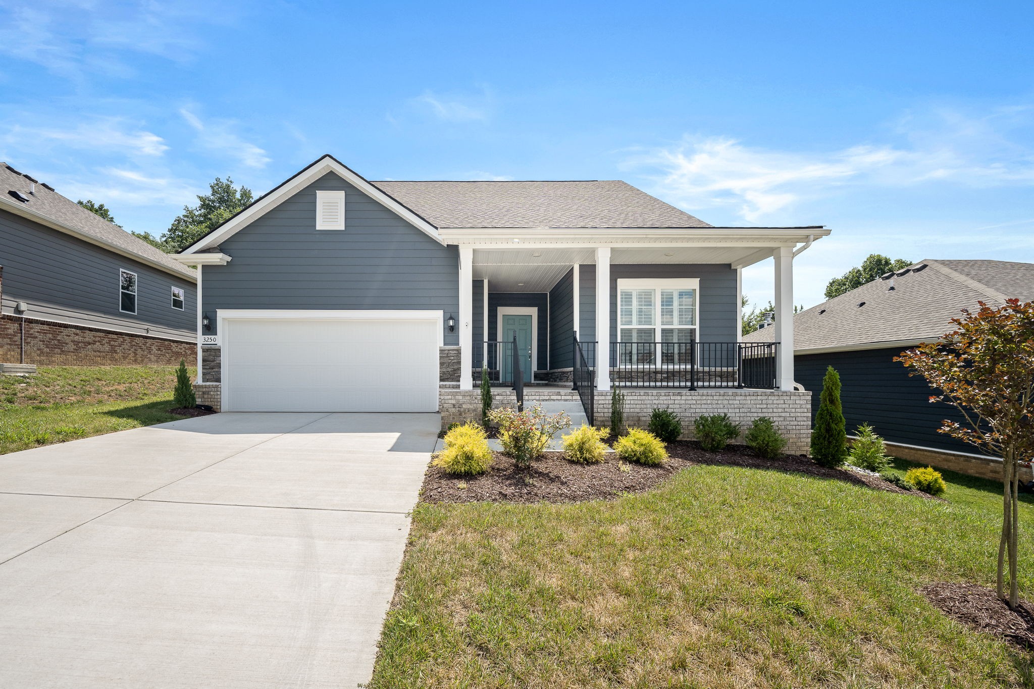 3250 Hearth Hollow Road Columbia, TN 38401 - Photo 20 of 36 a front view of a house with a yard and garage