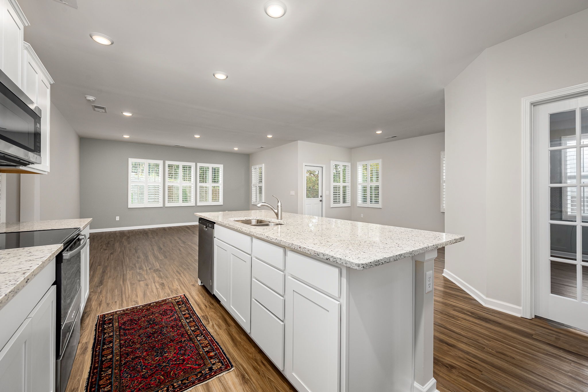 3250 Hearth Hollow Road Columbia, TN 38401 - Photo 22 of 36 a large kitchen with stainless steel appliances granite countertop a sink and a stove