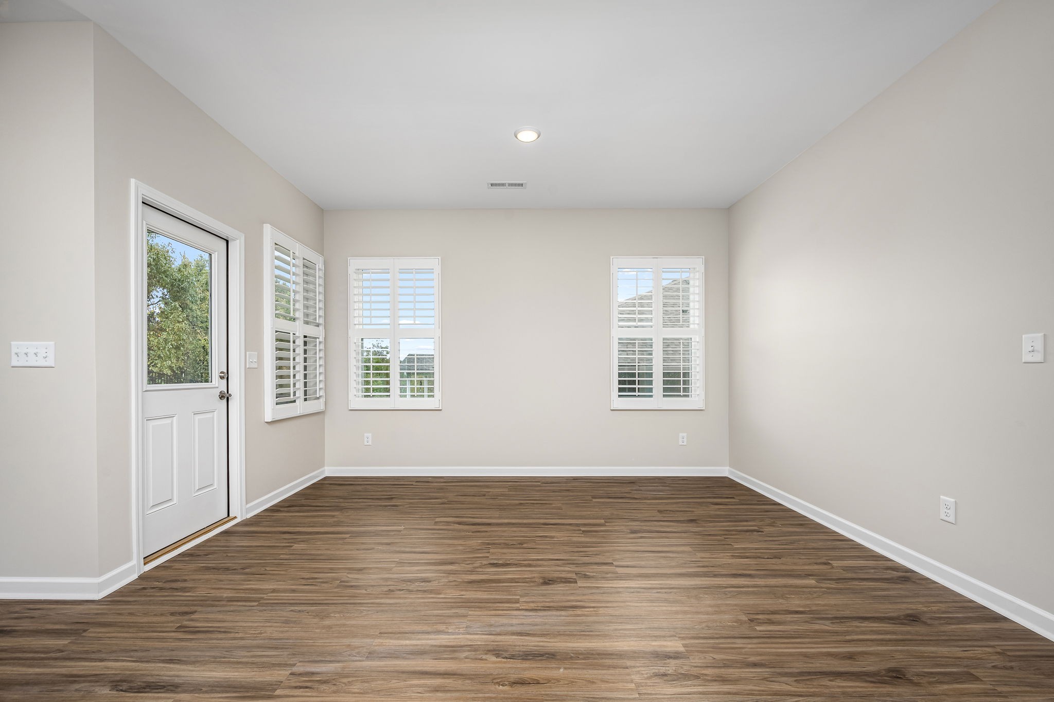 3250 Hearth Hollow Road Columbia, TN 38401 - Photo 24 of 36 a view of an empty room with wooden floor and a window