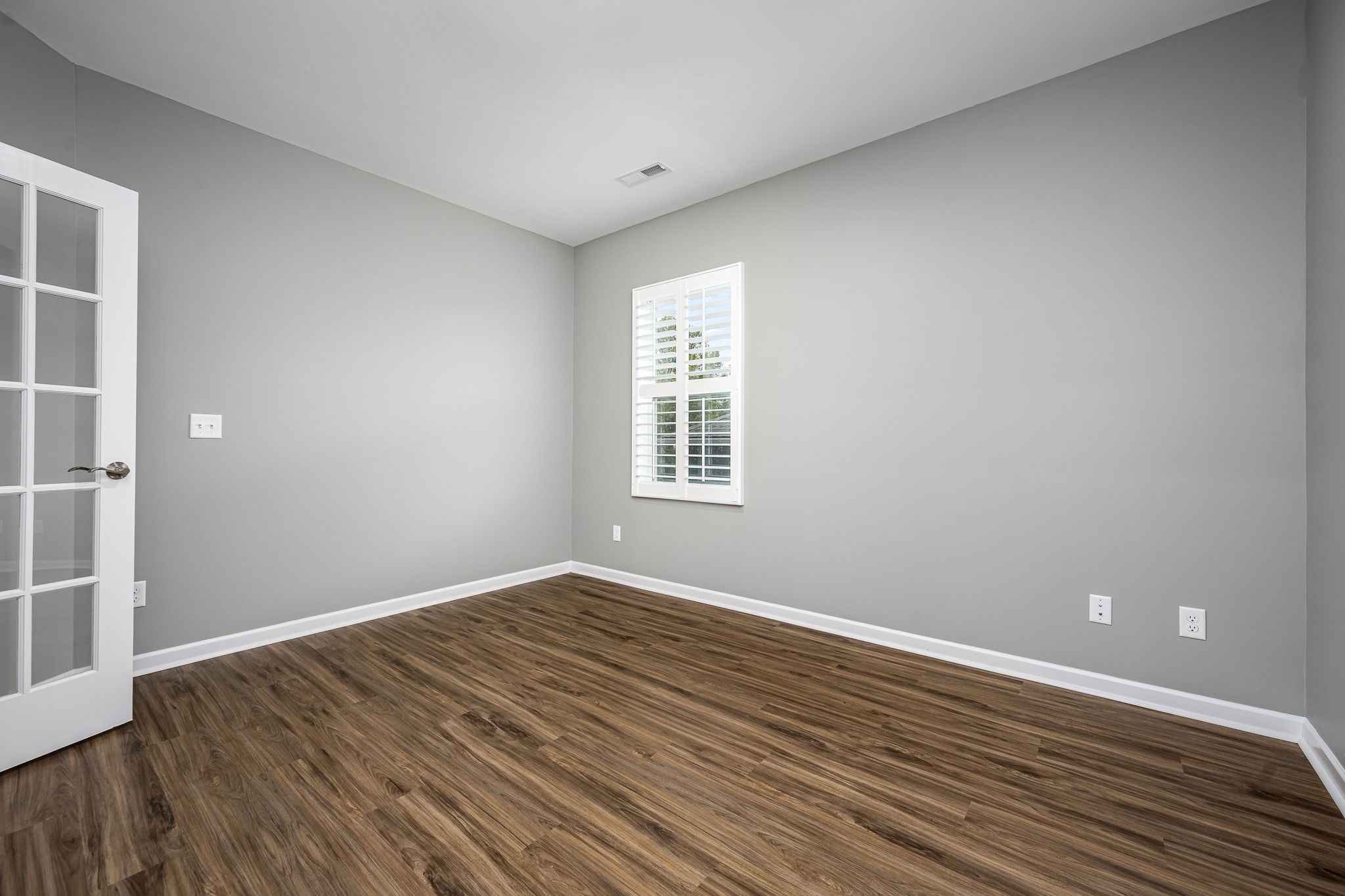 3250 Hearth Hollow Road Columbia, TN 38401 - Photo 27 of 36 a view of an empty room with wooden floor and a window