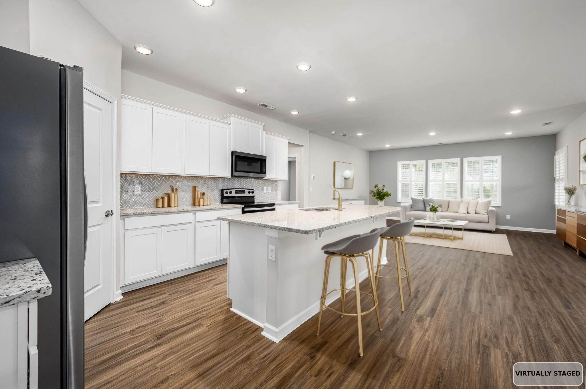 3250 Hearth Hollow Road Columbia, TN 38401 - Photo 3 of 36 a kitchen with white cabinets and appliances