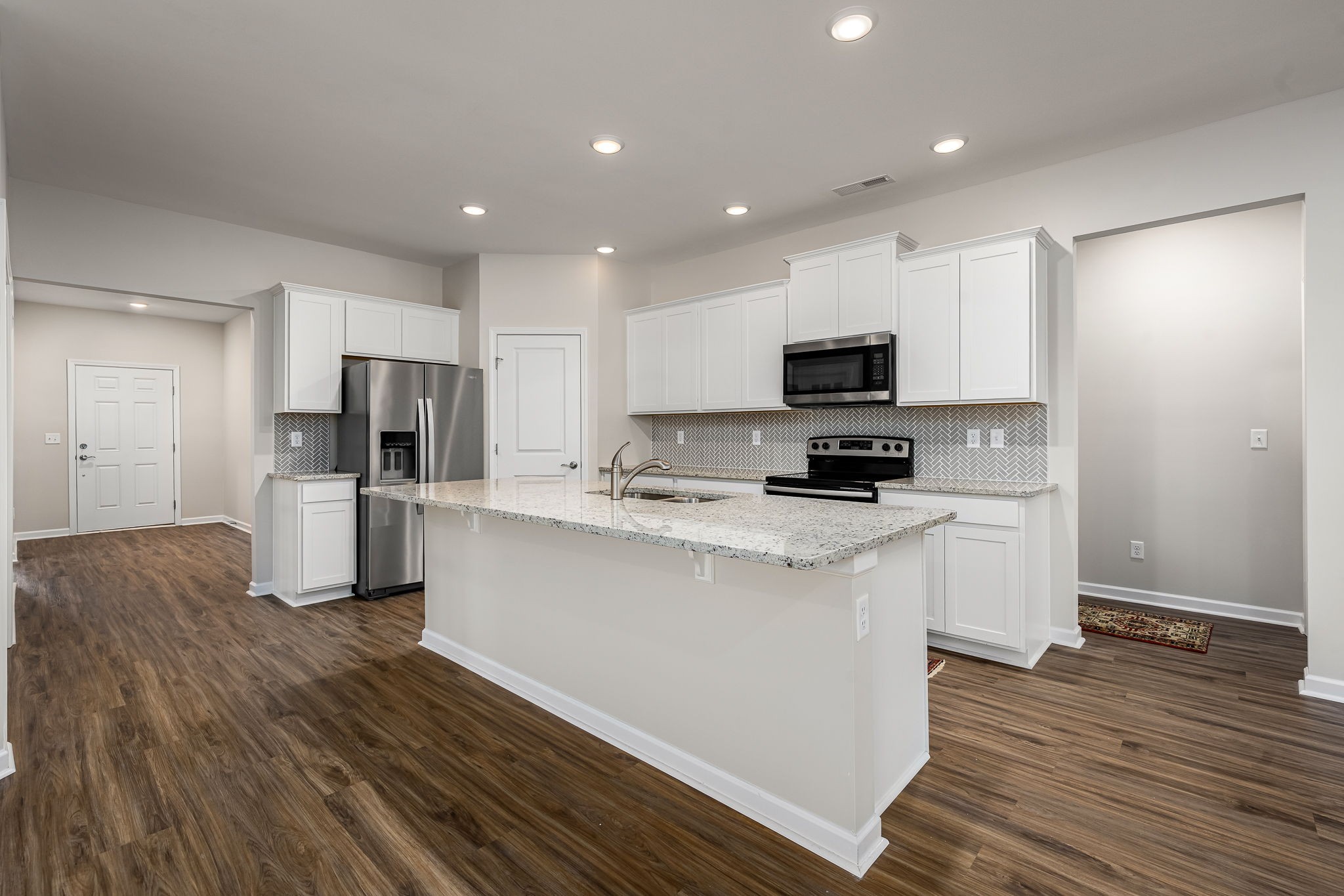 3250 Hearth Hollow Road Columbia, TN 38401 - Photo 6 of 36 a kitchen with a refrigerator and a stove top oven