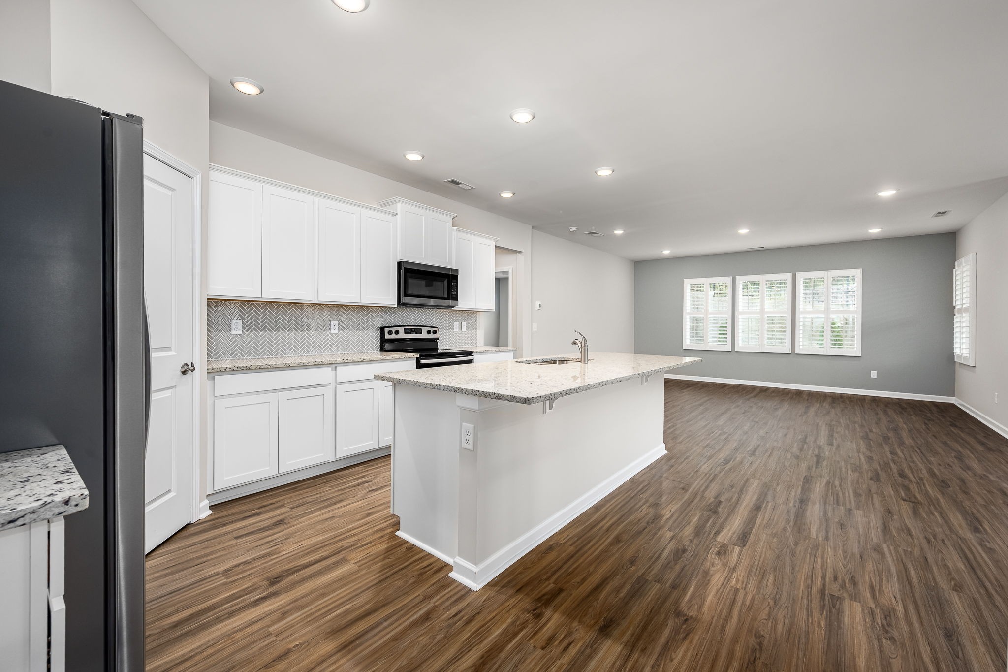 3250 Hearth Hollow Road Columbia, TN 38401 - Photo 7 of 36 a kitchen with a refrigerator and white cabinets