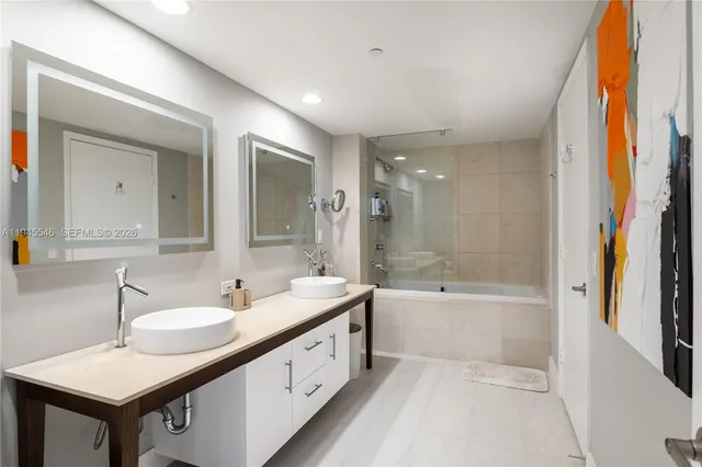 a row of palm trees and a yard in front of a building