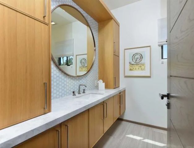 a bathroom with a sink and a mirror