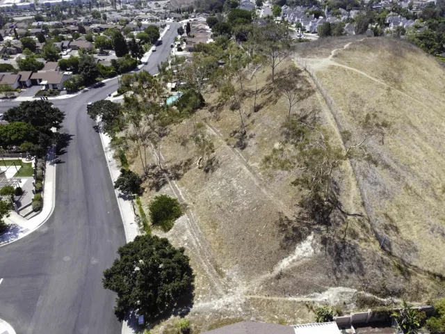 an aerial view of city and mountain