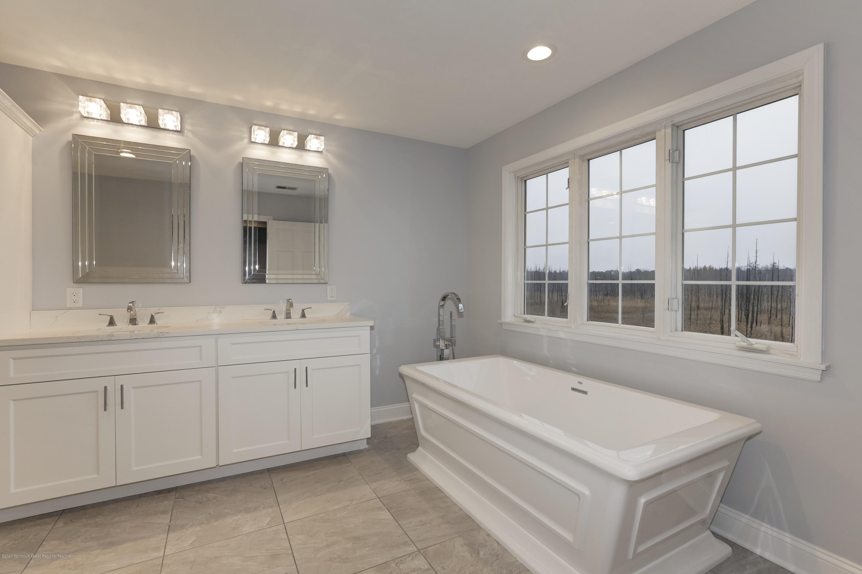 153 Royal Drive Brick, NJ 08723 - Photo 23 of 32 a spacious bathroom with a tub sink and mirror