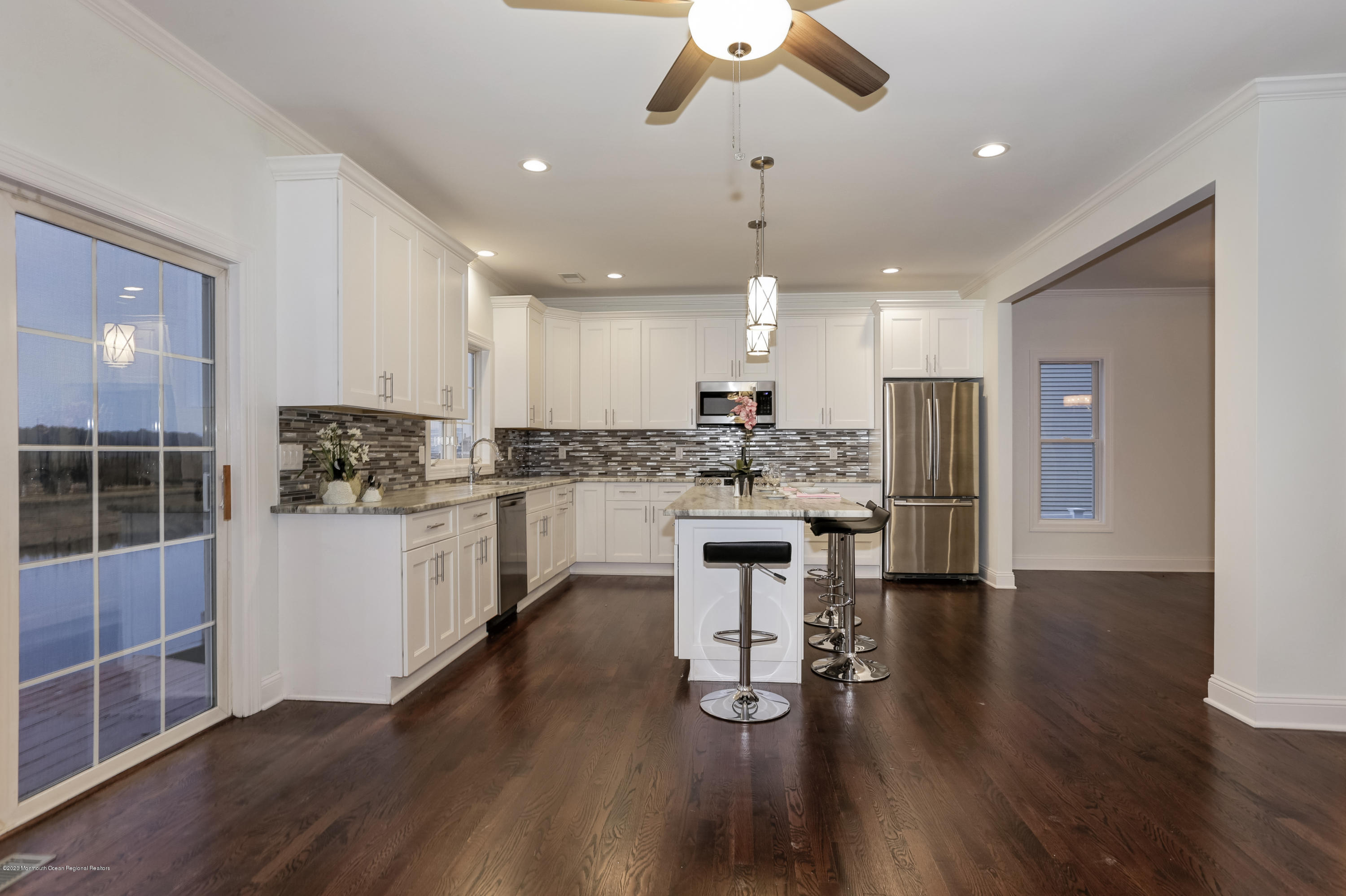 153 Royal Drive Brick, NJ 08723 - Photo 10 of 32 a kitchen with a refrigerator and white cabinets