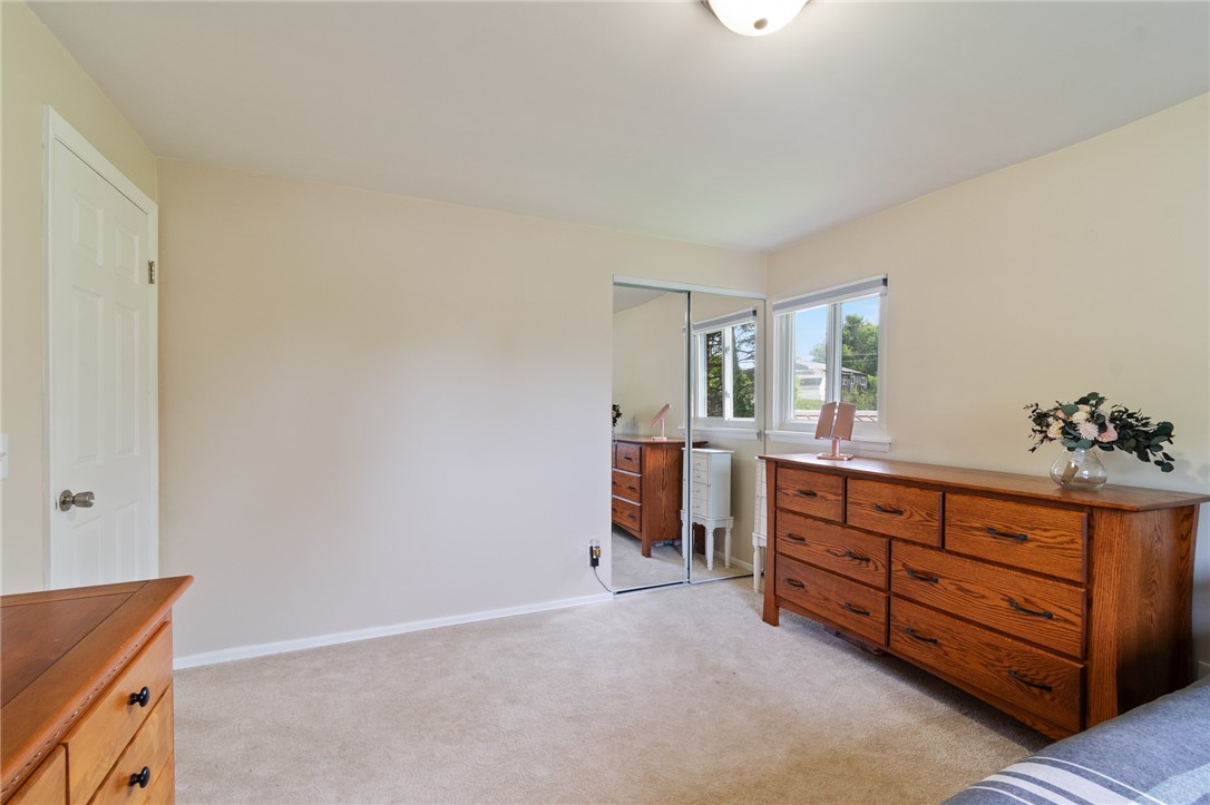 218 Kusak Road Henrietta, NY 14467 - Photo 14 of 33 Second bedroom with mirrored sliding door closet.