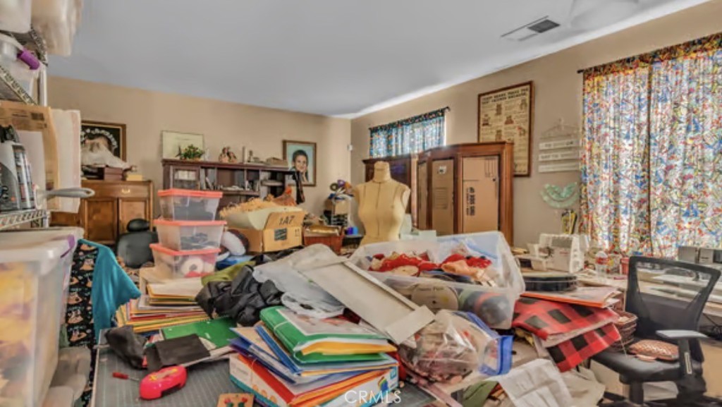 52117 Genoa Street Coachella, CA 92236 - Photo 20 of 35 a living room filled with furniture and a chandelier