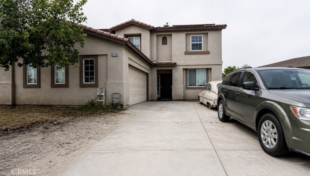 52117 Genoa Street Coachella, CA 92236 - Photo 2 of 35 a view of a car in front of house