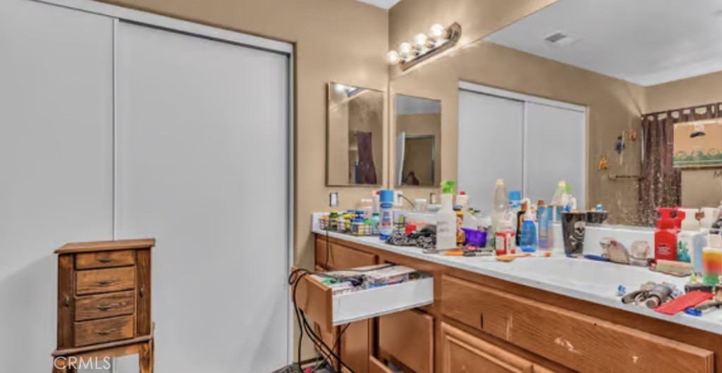52117 Genoa Street Coachella, CA 92236 - Photo 22 of 35 a bathroom with a sink and a mirror