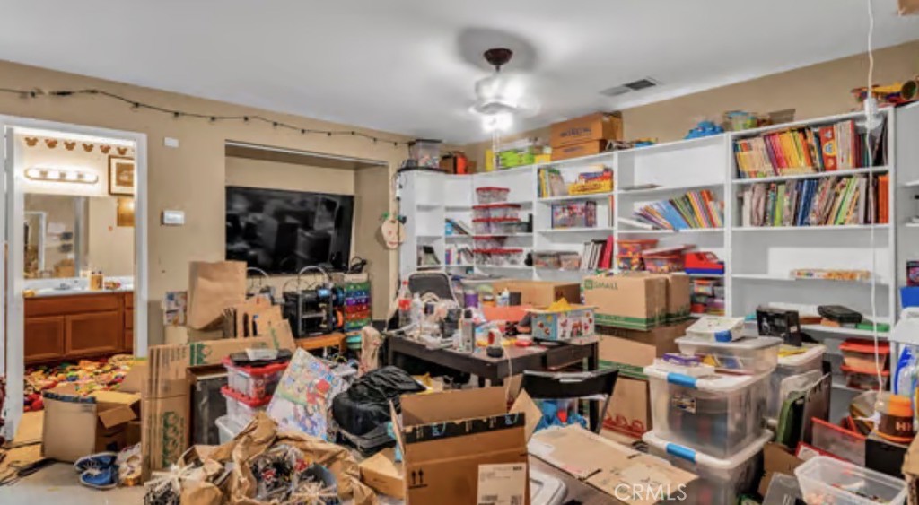 52117 Genoa Street Coachella, CA 92236 - Photo 25 of 35 a room with lots of furniture and clutter