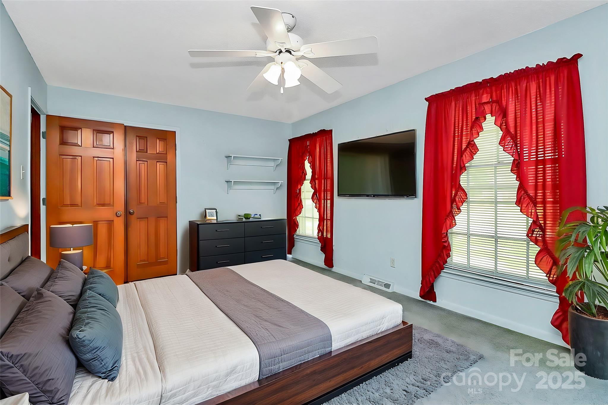 1801 Windsor Drive Lancaster, SC 29720 - Photo 13 of 28 a bedroom with a bed and wooden floor