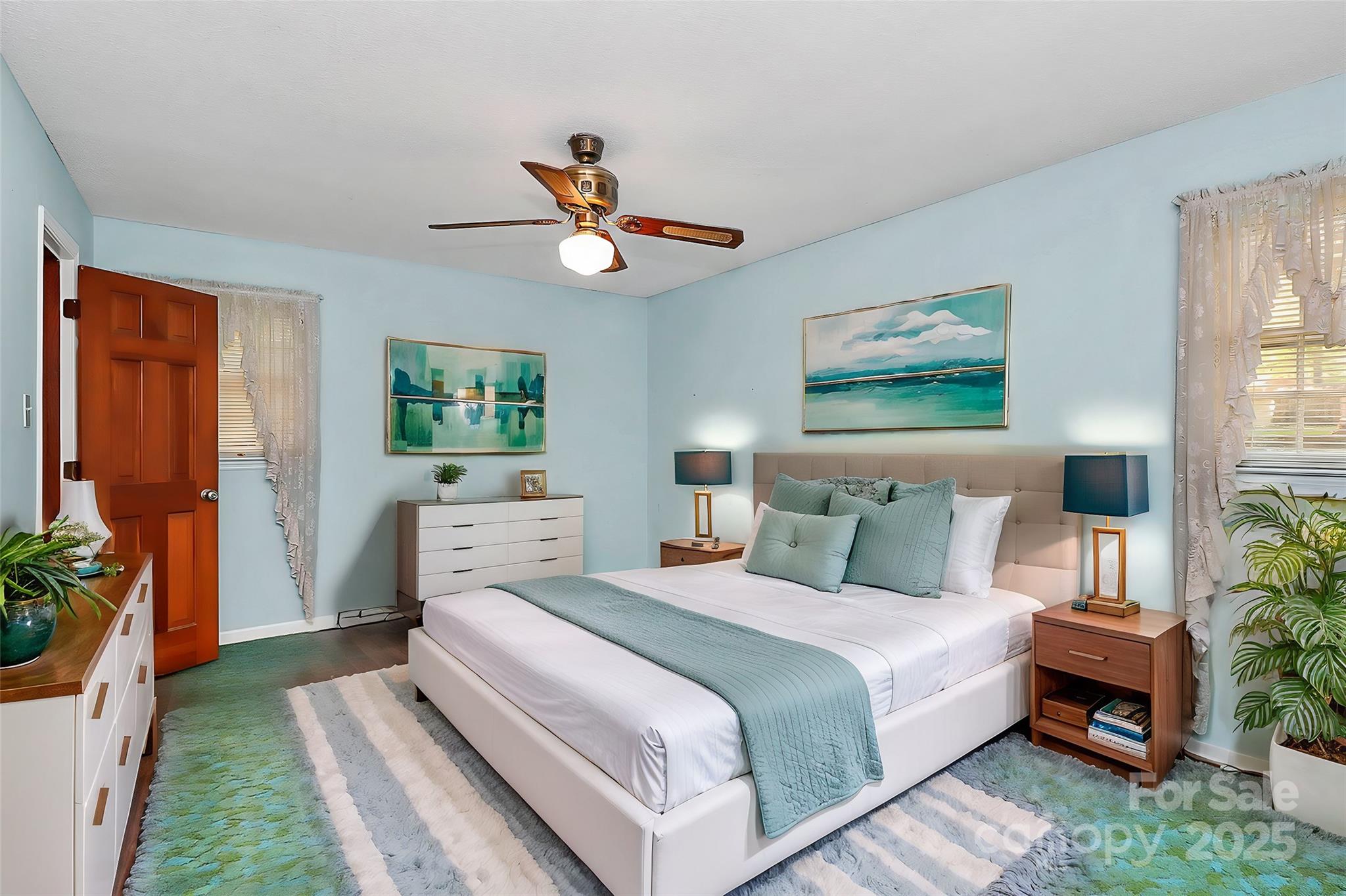 1801 Windsor Drive Lancaster, SC 29720 - Photo 4 of 28 a bedroom with a bed a couch and paintings on the wall