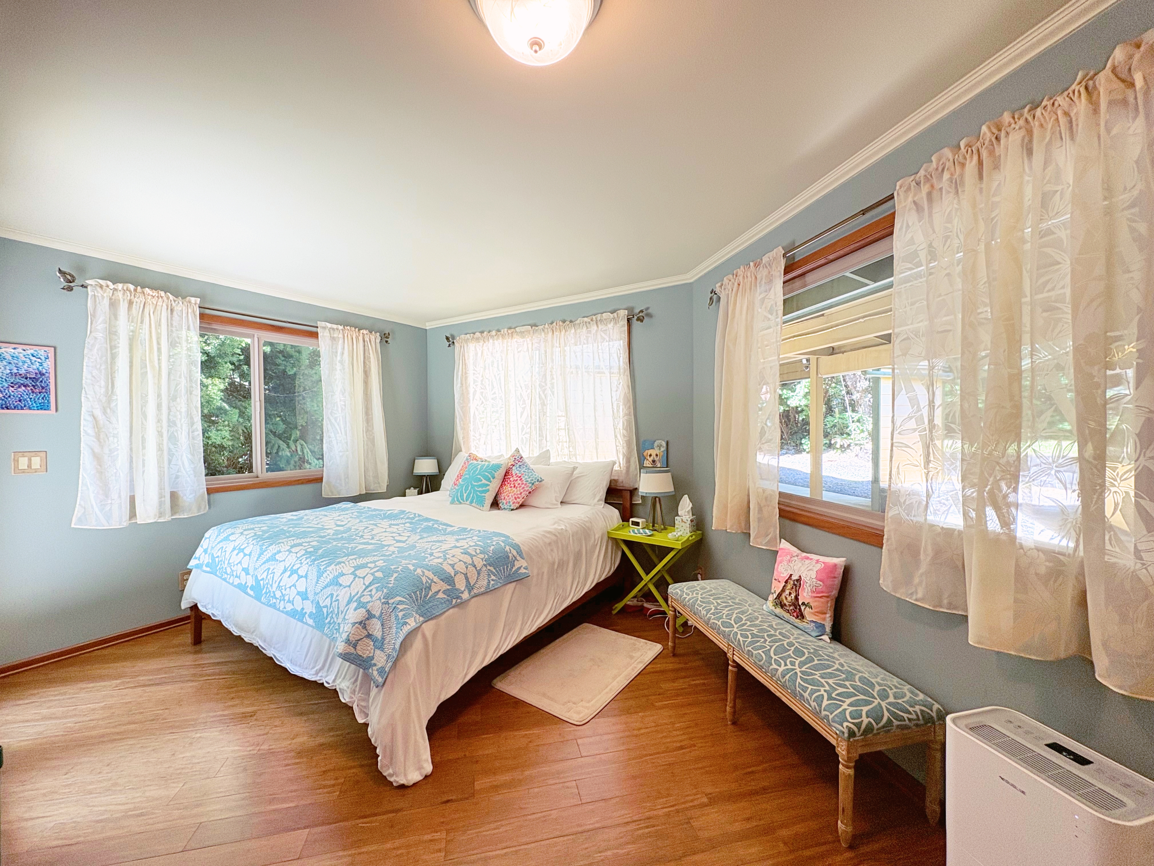 19-4218 Kawailehua Road Volcano, HI 96785 - Photo 11 of 30 a bedroom with a bed and wooden floor