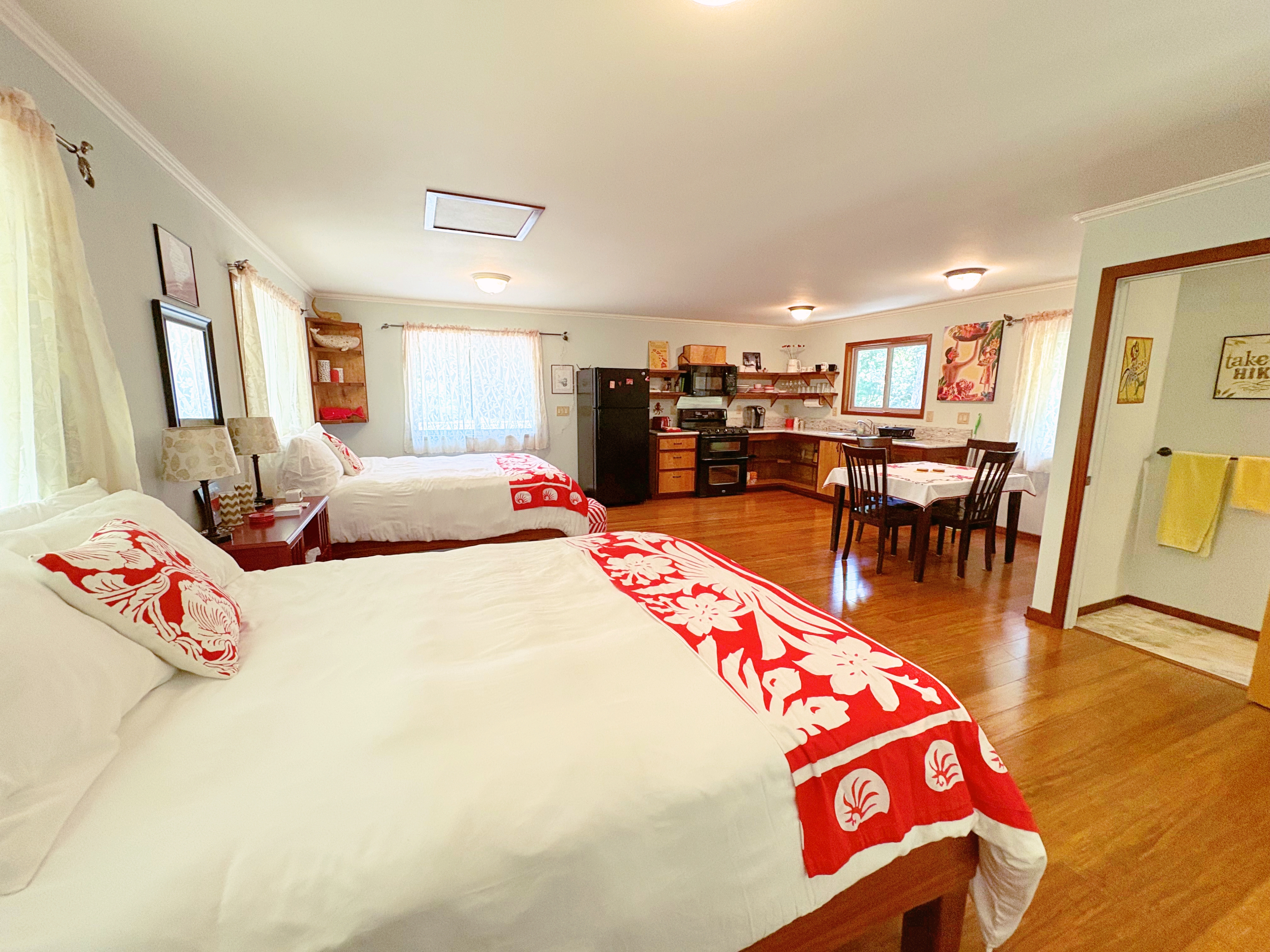 19-4218 Kawailehua Road Volcano, HI 96785 - Photo 19 of 30 a bedroom with furniture and a wooden floor