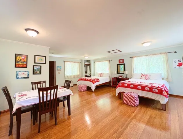 a bedroom with bed and window