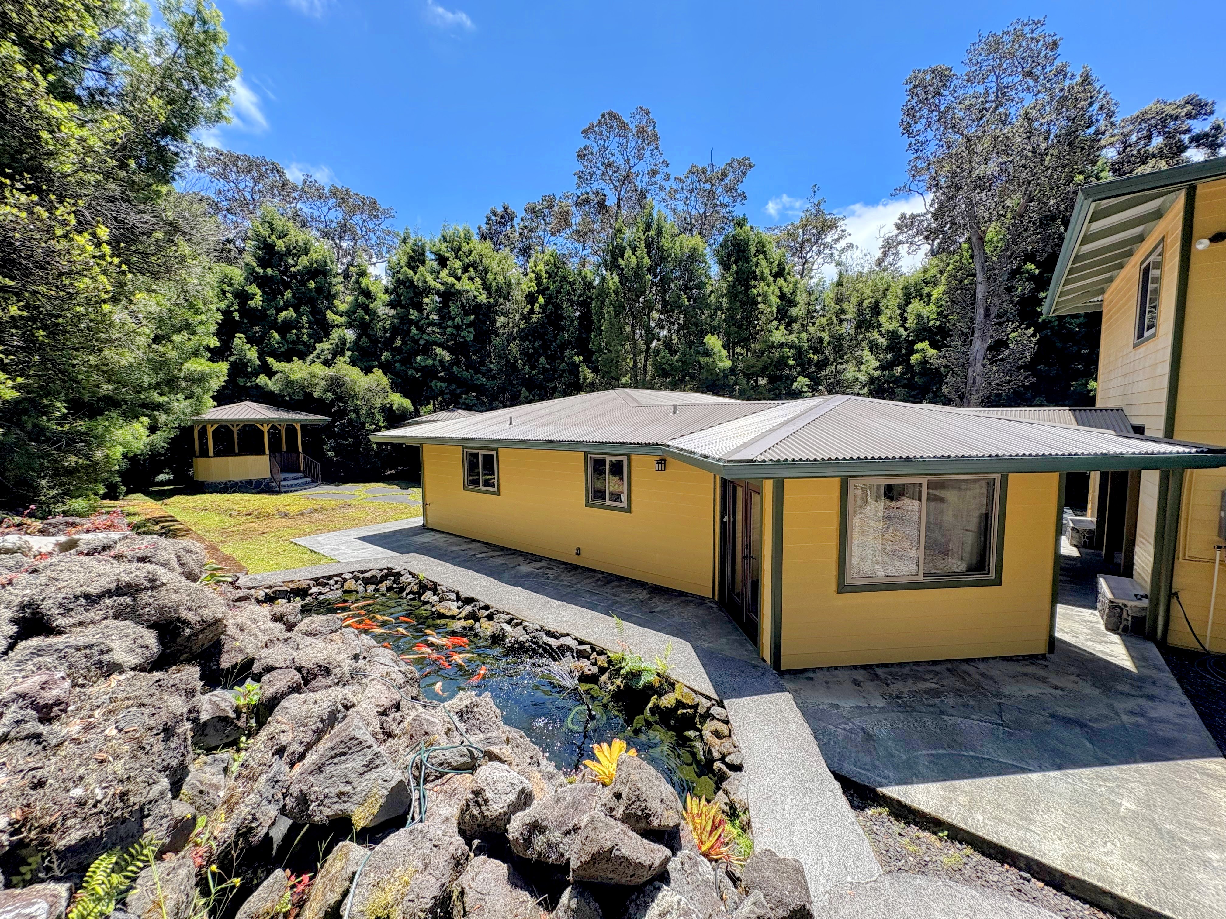19-4218 Kawailehua Road Volcano, HI 96785 - Photo 27 of 30 a view of a house with a yard