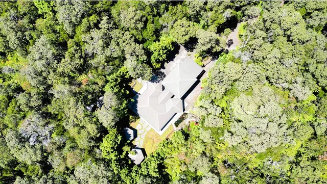a bathroom view of a road and a building