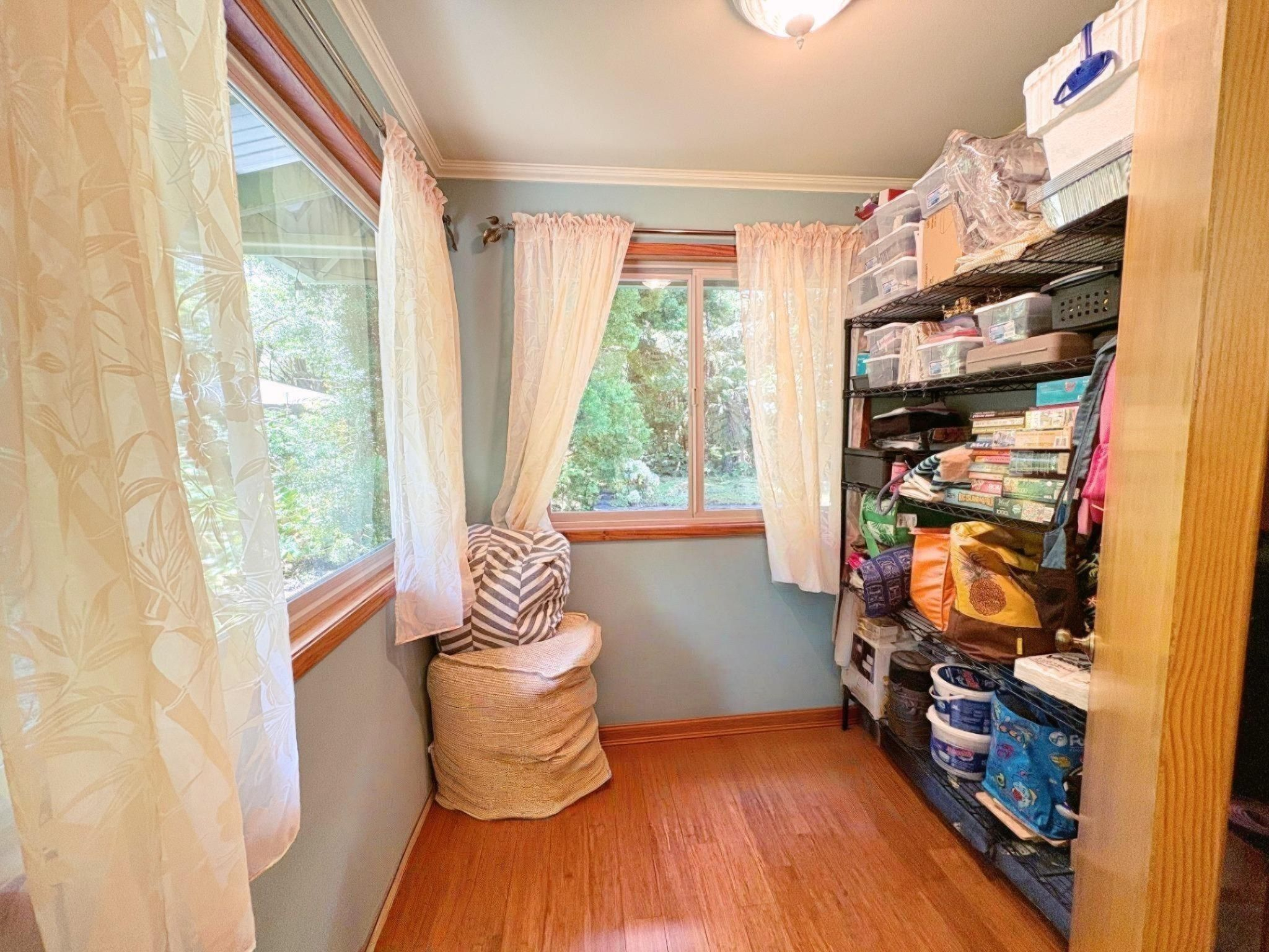 19-4218 Kawailehua Road Volcano, HI 96785 - Photo 10 of 30 a room with wooden floor and a window