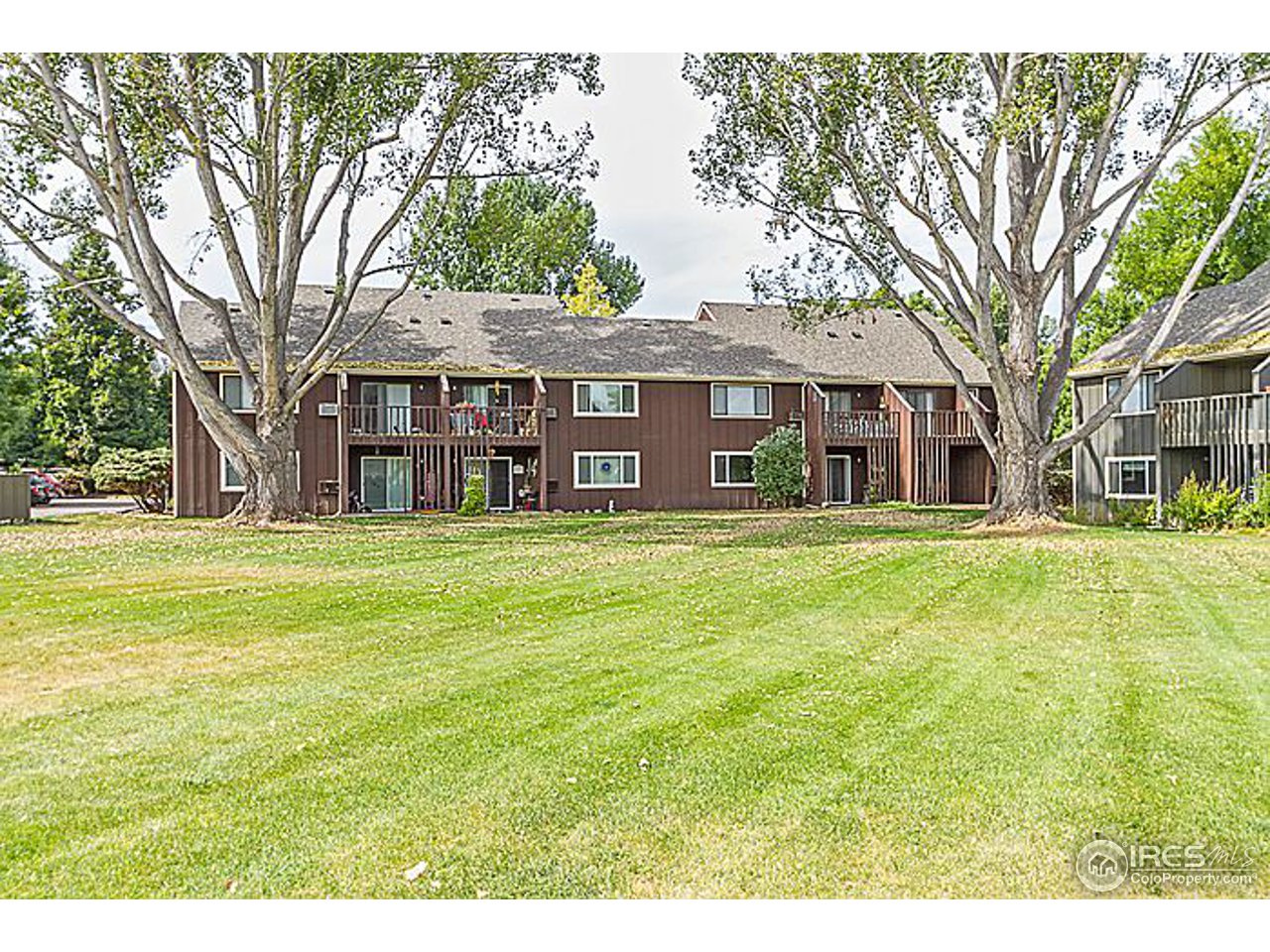 801 East Drake Road, Unit 83 Fort Collins, CO 80525 - Photo 1 of 21 a front view of a house with a garden