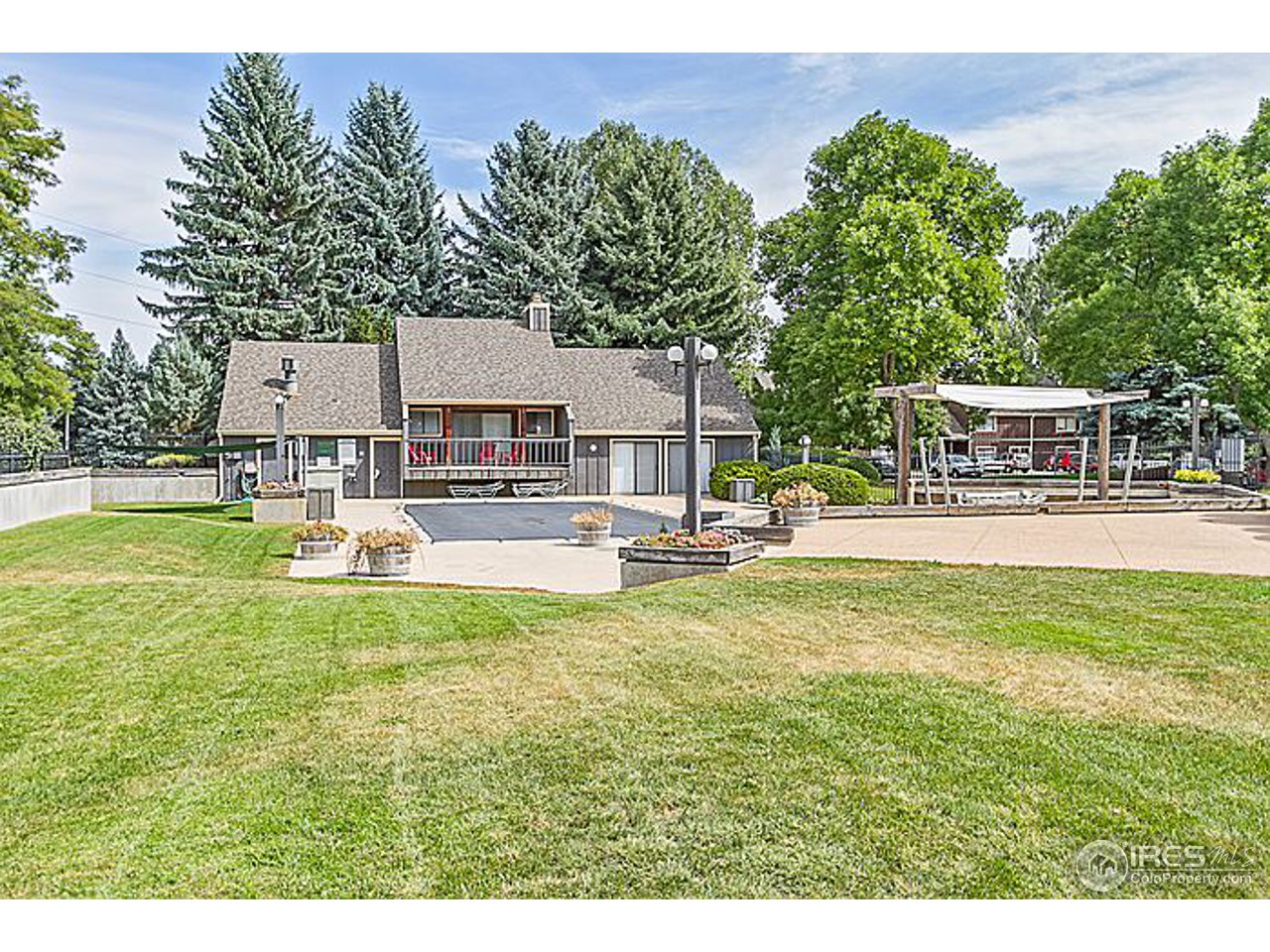 801 East Drake Road, Unit 83 Fort Collins, CO 80525 - Photo 20 of 21 a view of a house with a big yard and sitting area