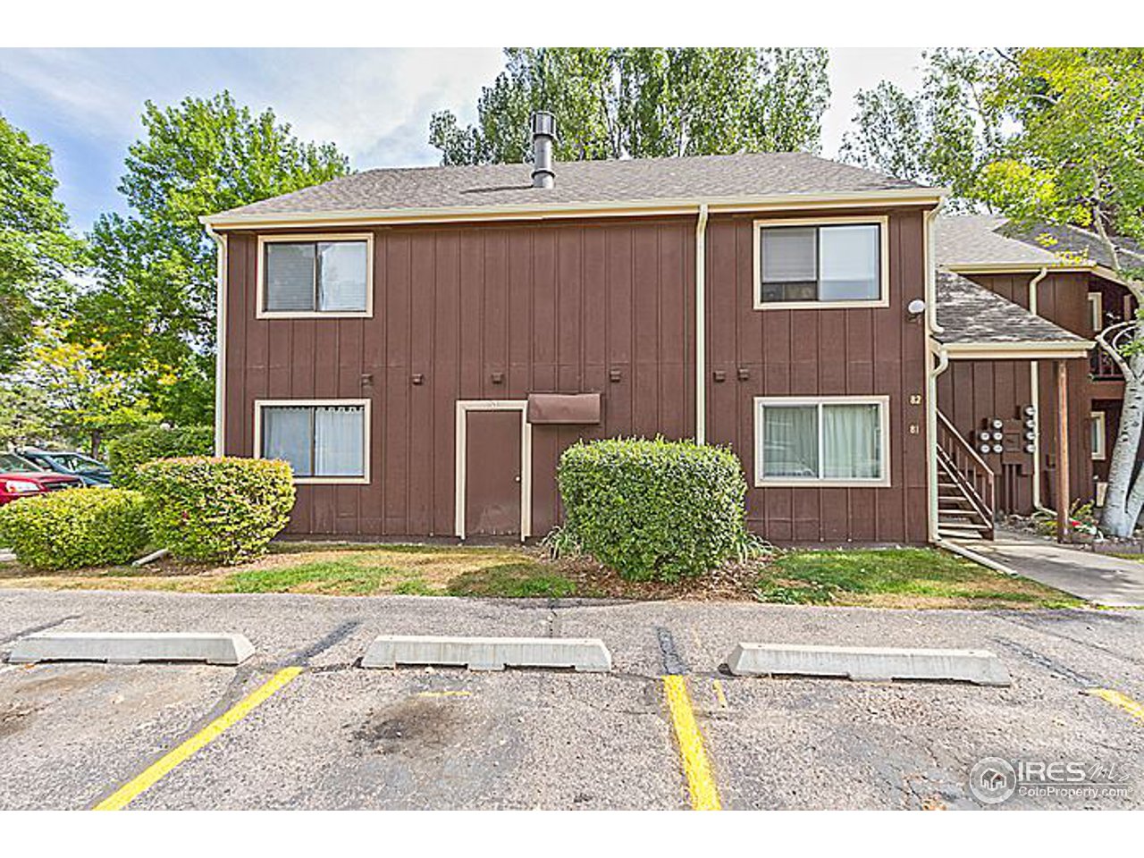 801 East Drake Road, Unit 83 Fort Collins, CO 80525 - Photo 2 of 21 a view of a house with a yard