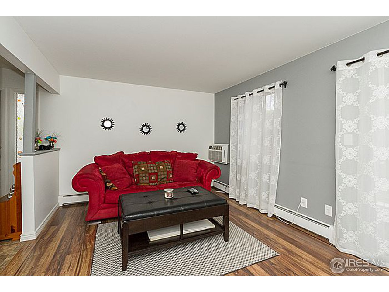801 East Drake Road, Unit 83 Fort Collins, CO 80525 - Photo 3 of 21 a sitting area with furniture and wooden floor