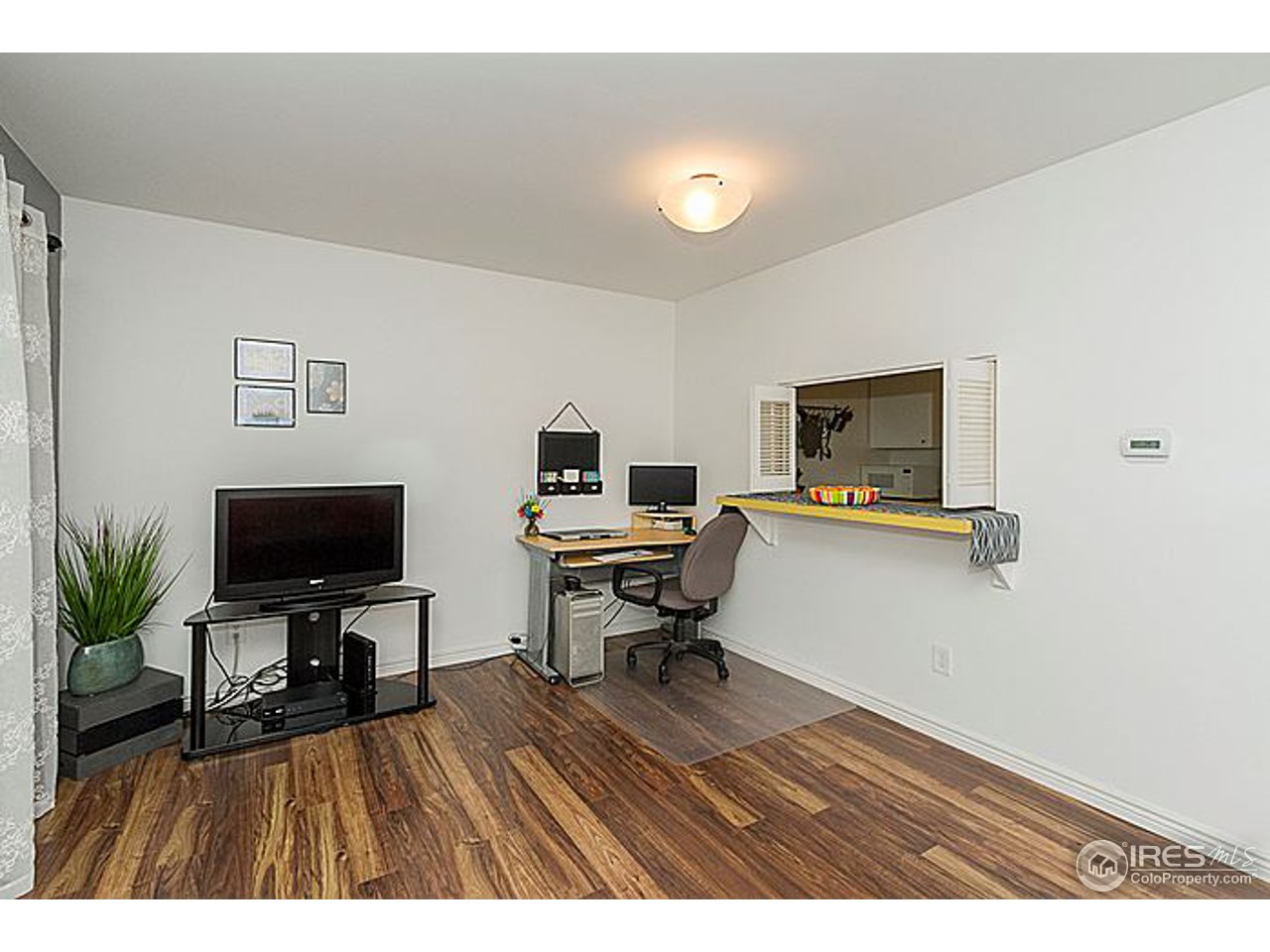 801 East Drake Road, Unit 83 Fort Collins, CO 80525 - Photo 6 of 21 a living room with furniture and a flat screen tv