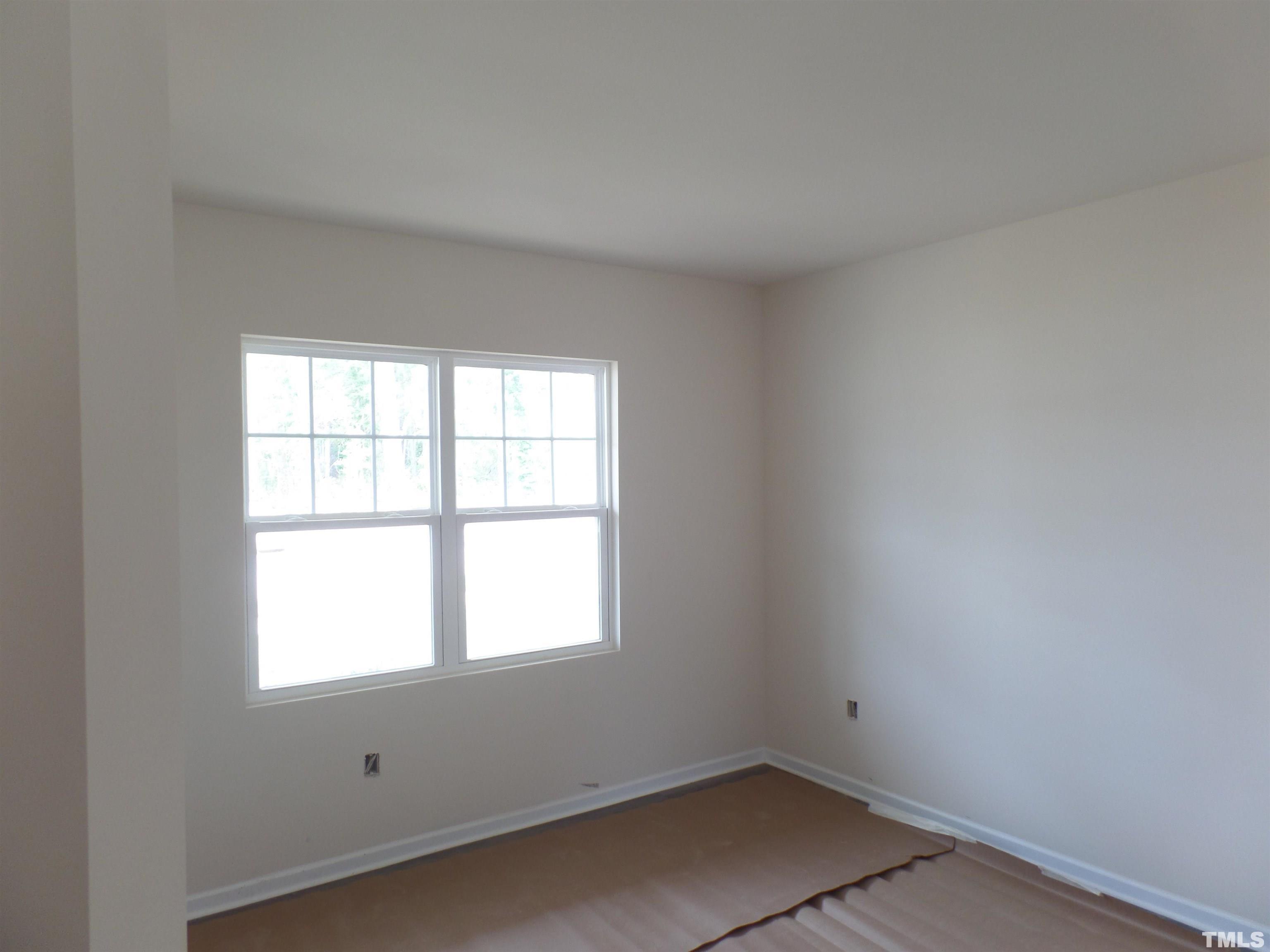 1632 Arapahoe Ridge Drive Raleigh, NC 27604 - Photo 11 of 28 an empty room with a window