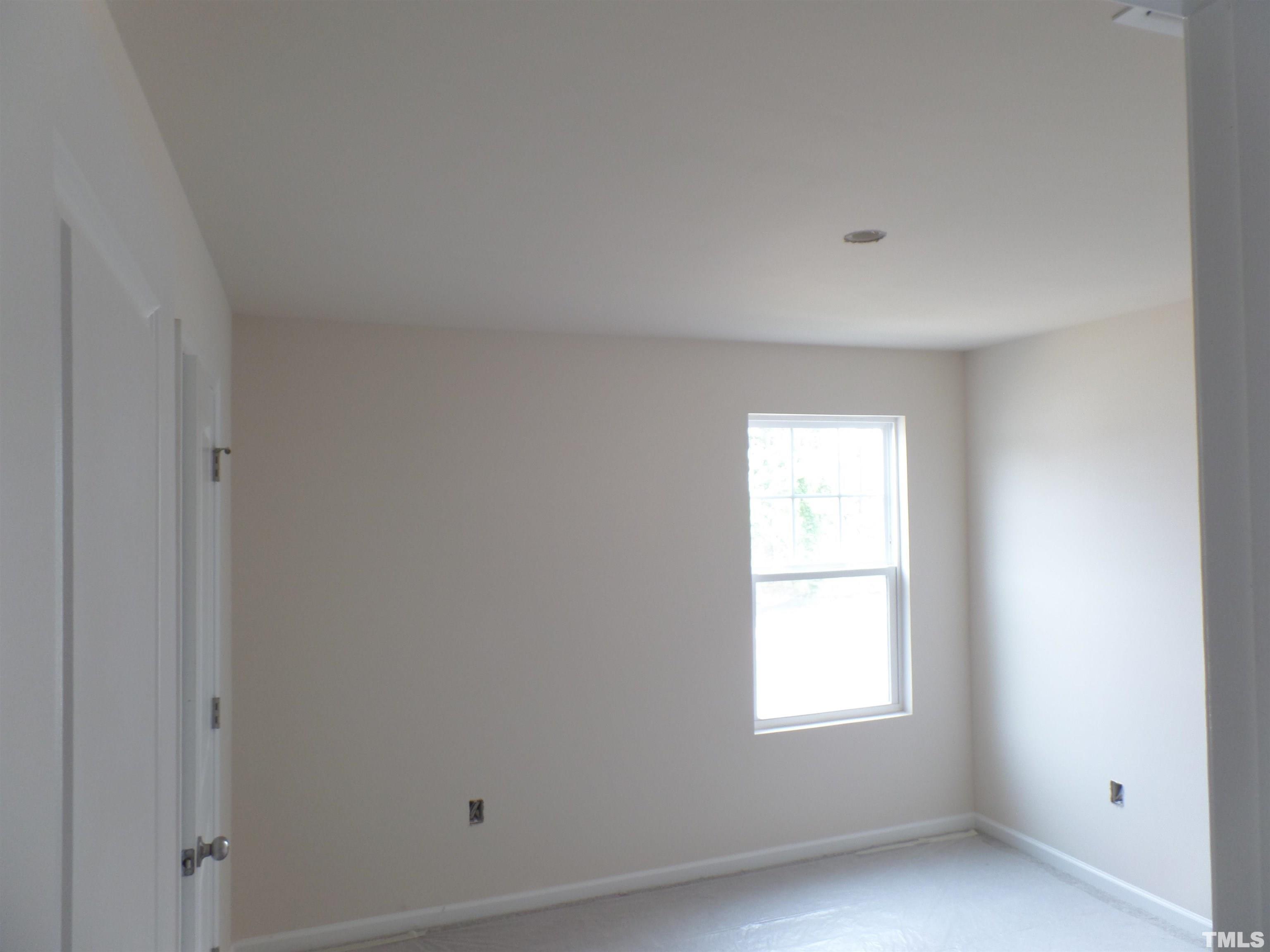 1632 Arapahoe Ridge Drive Raleigh, NC 27604 - Photo 15 of 28 an empty room with a window