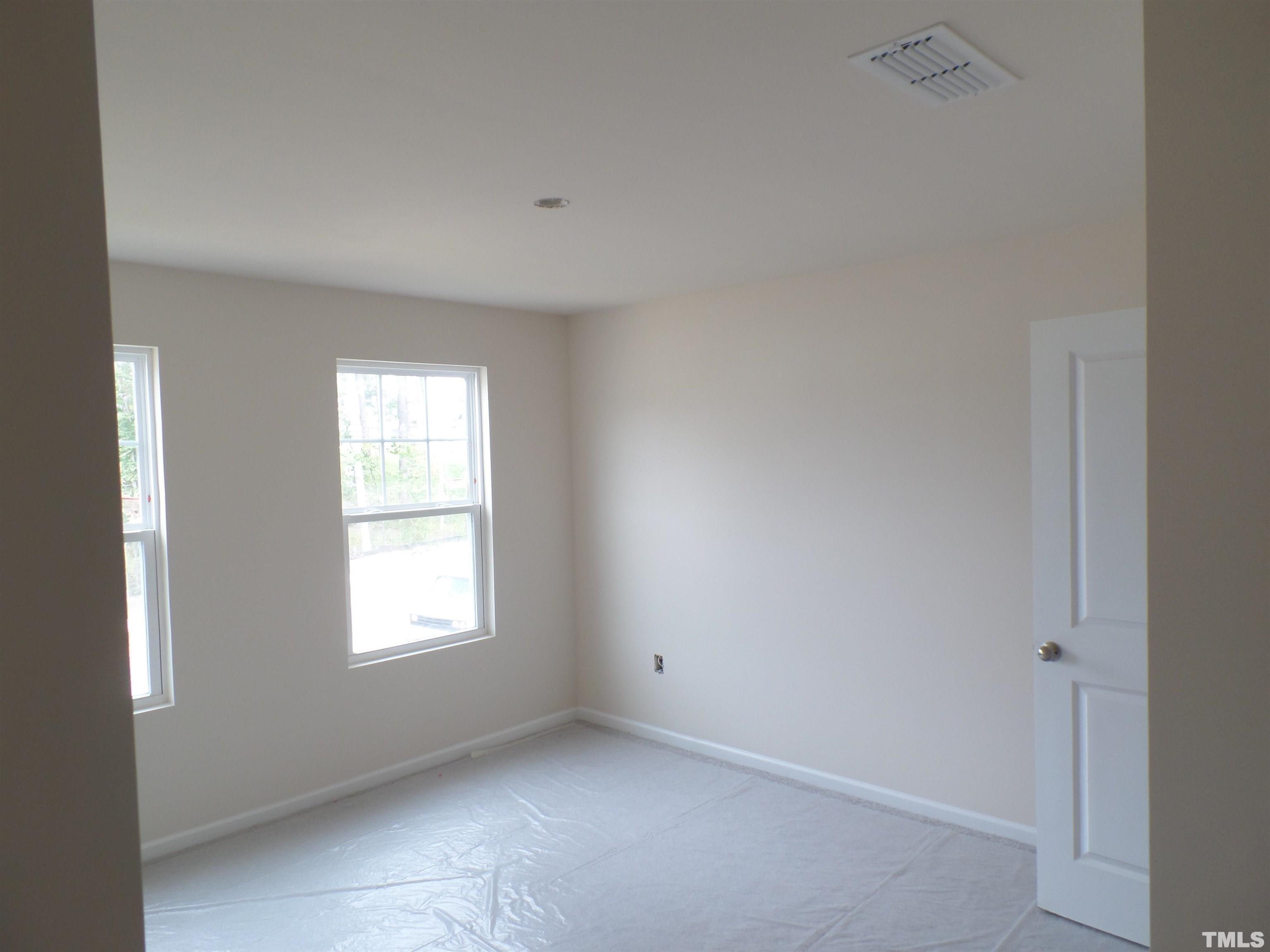 1632 Arapahoe Ridge Drive Raleigh, NC 27604 - Photo 17 of 28 a view of an empty room with a window