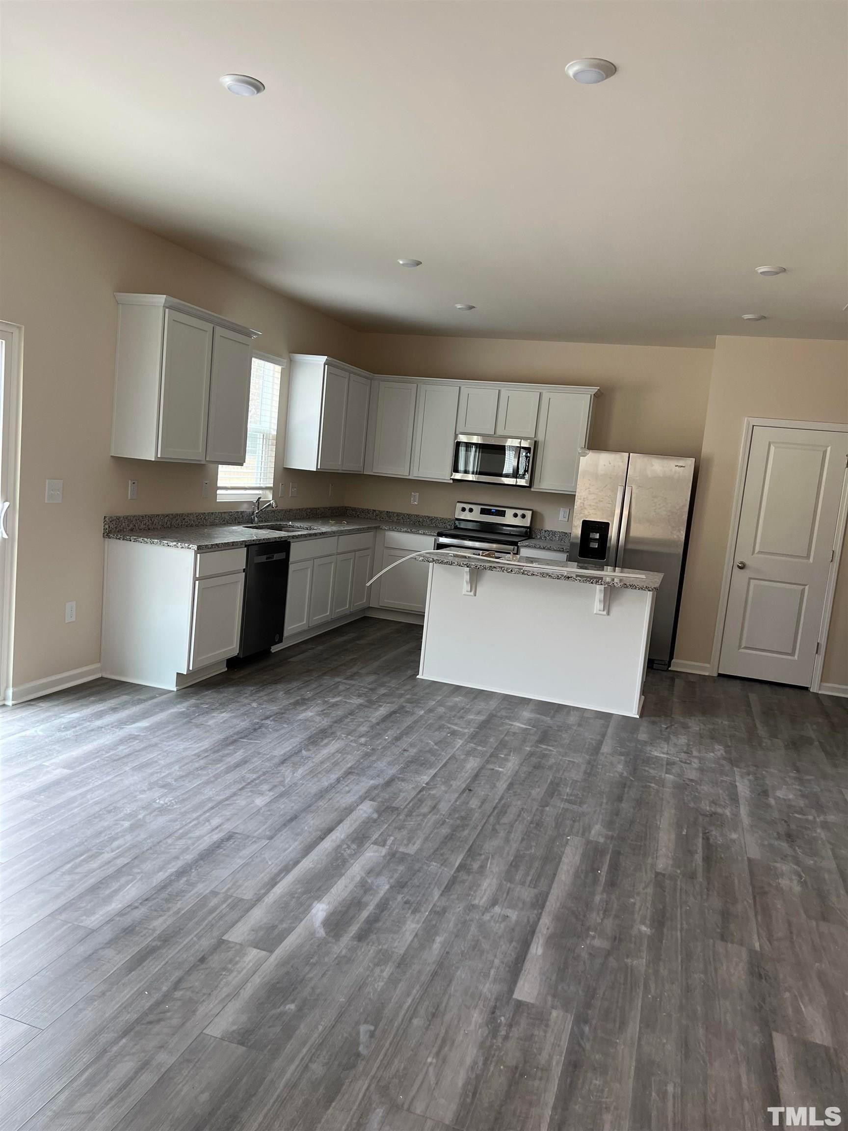 1632 Arapahoe Ridge Drive Raleigh, NC 27604 - Photo 4 of 28 a view of kitchen with wooden floor and electronic appliances