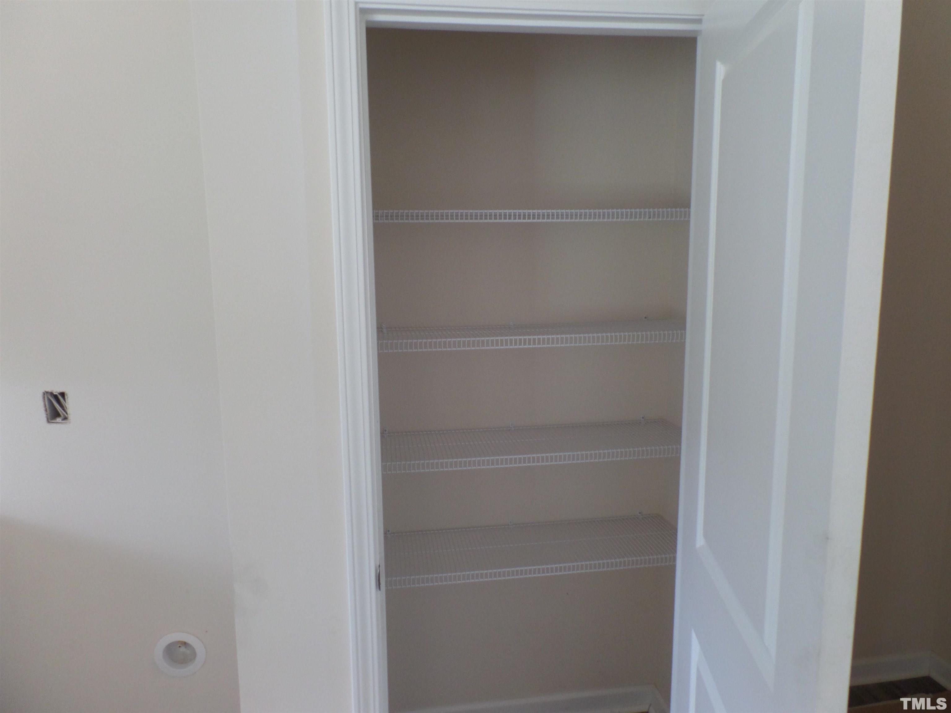 1632 Arapahoe Ridge Drive Raleigh, NC 27604 - Photo 6 of 28 a view of walk in closet with empty racks