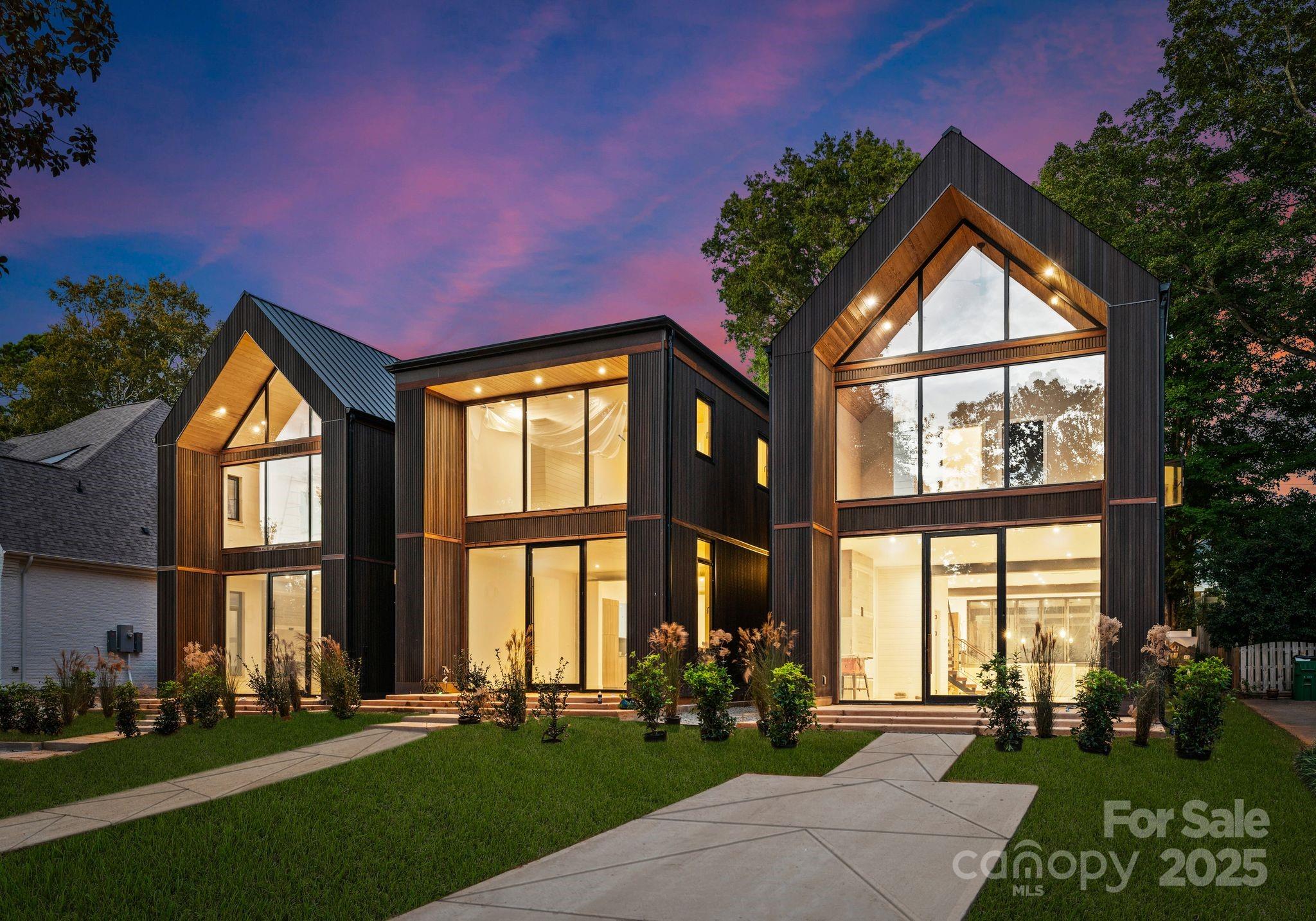 421 Marsh Road, Unit 102 Charlotte, NC 28209 - Photo 1 of 23 a front view of a house with a yard