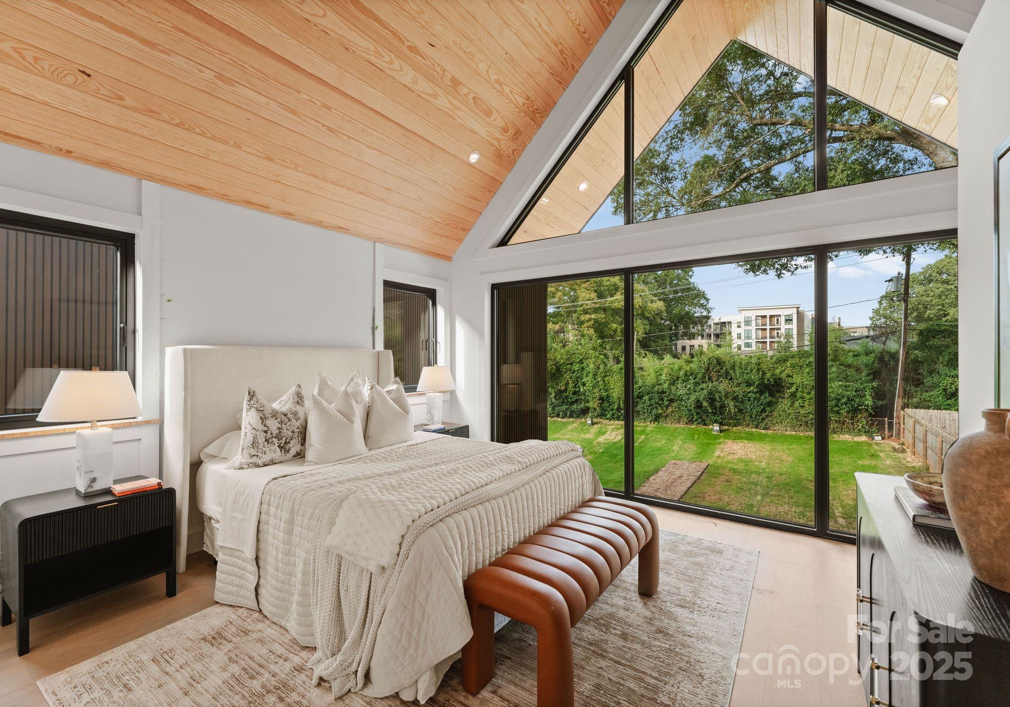 421 Marsh Road, Unit 102 Charlotte, NC 28209 - Photo 17 of 23 a bedroom with a bed and a view of balcony