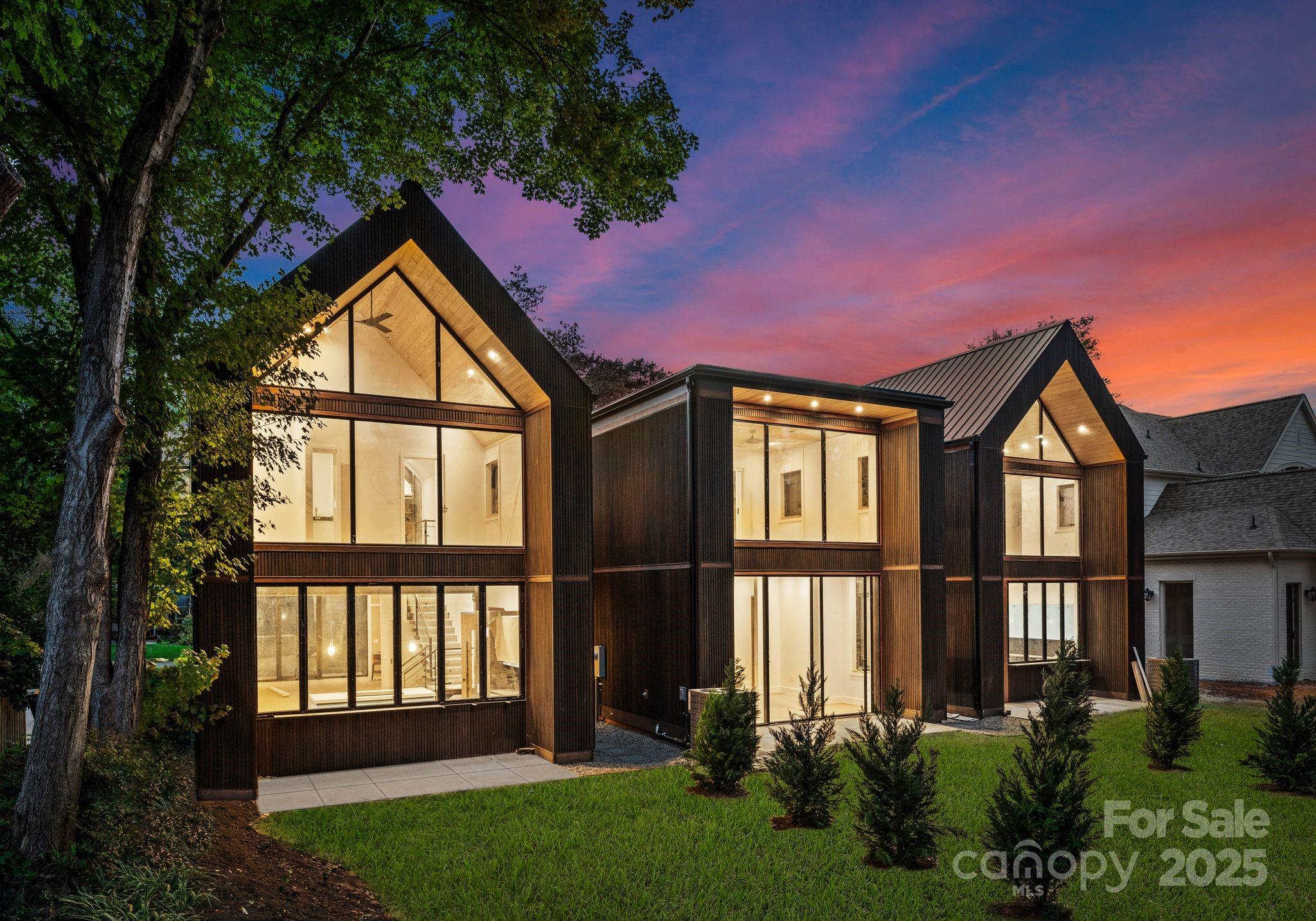 421 Marsh Road, Unit 102 Charlotte, NC 28209 - Photo 2 of 23 a front view of a house with a yard