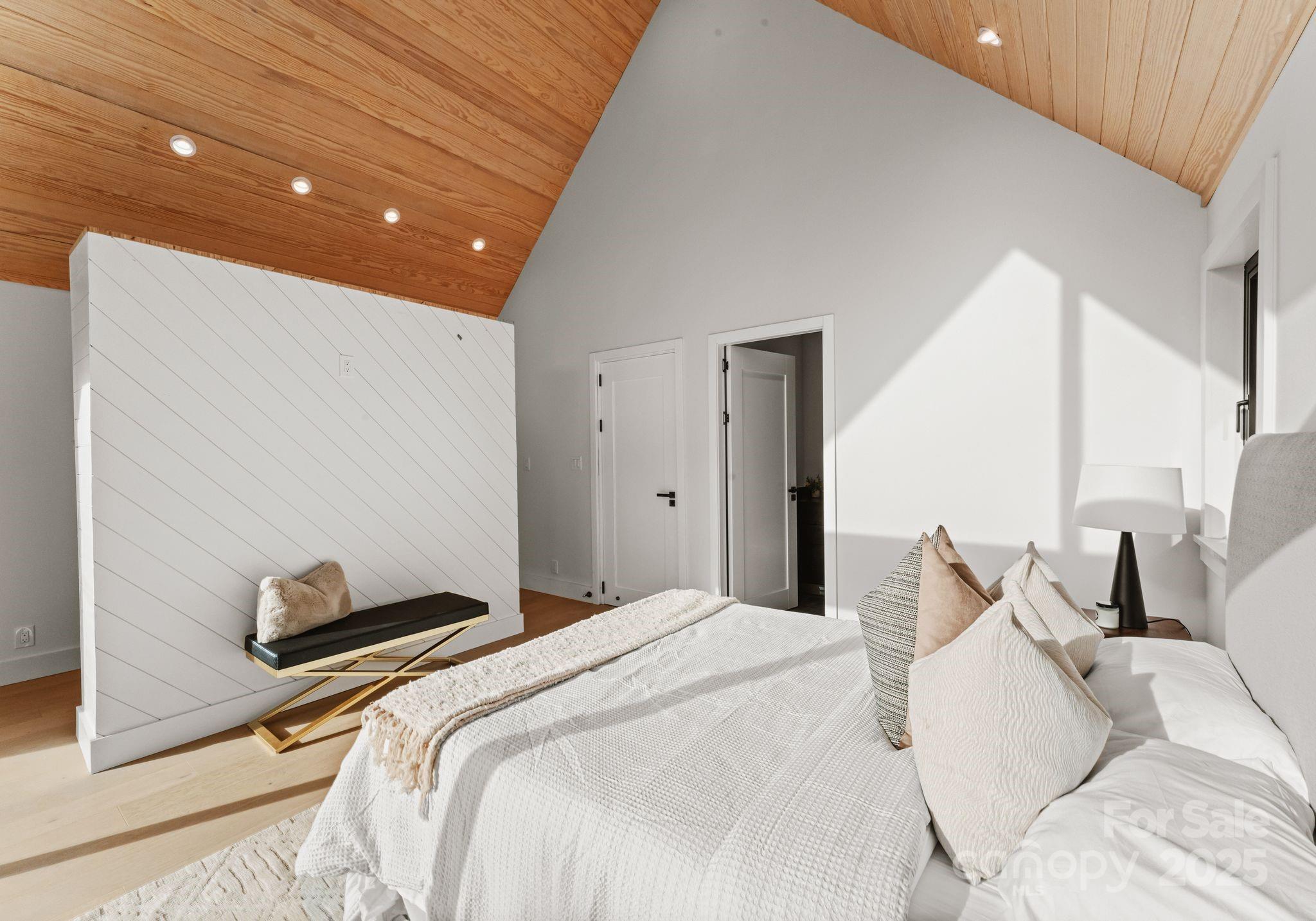 421 Marsh Road, Unit 102 Charlotte, NC 28209 - Photo 23 of 23 a bedroom with a bed and a night stand