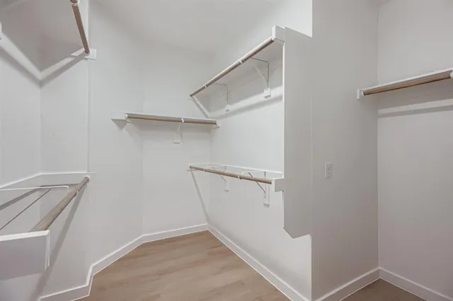 a view of an empty walk in closet
