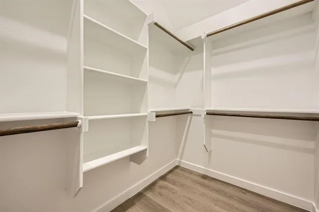 a view of an empty walk in closet