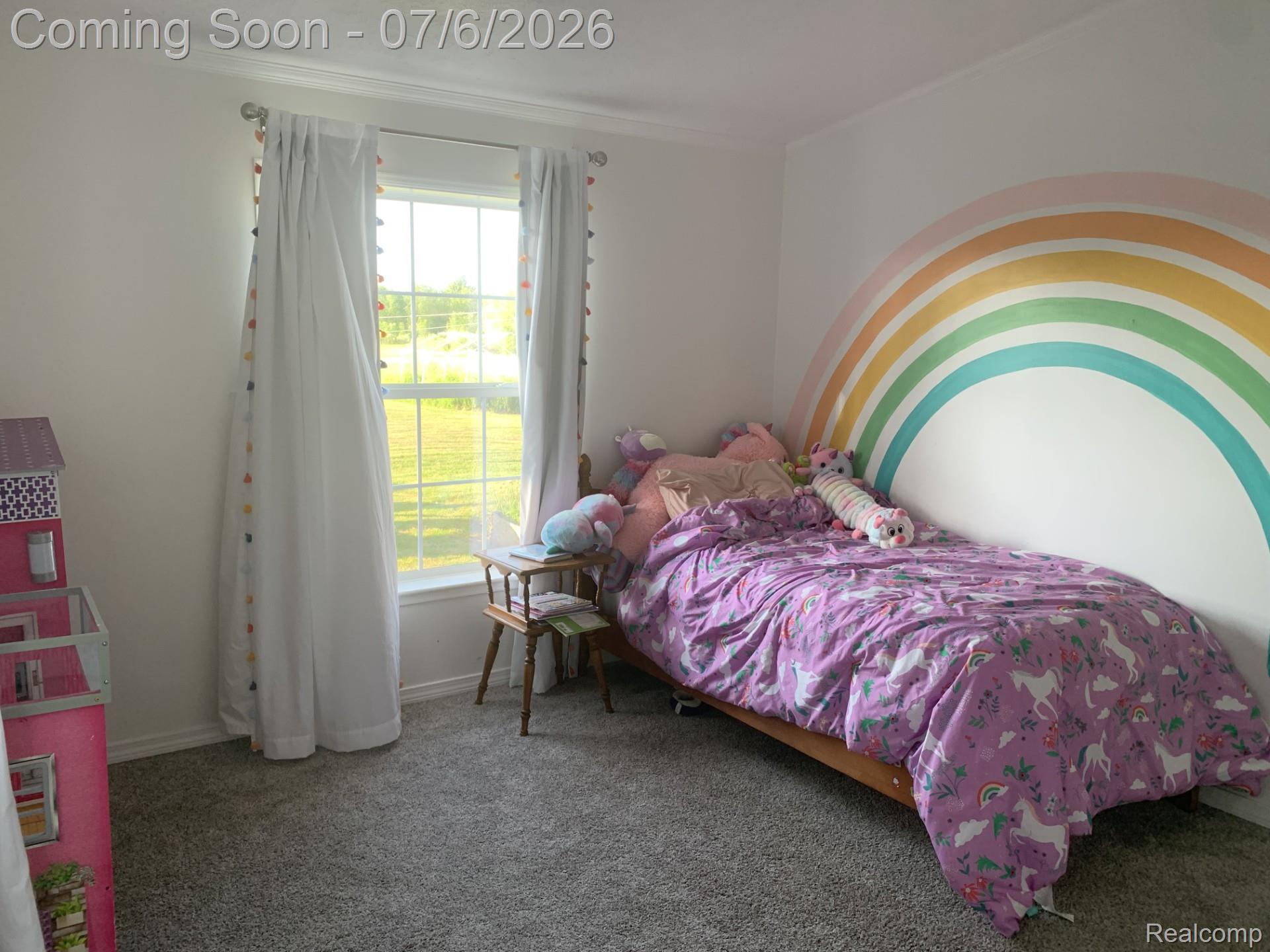 4168 Harris Road Fort Gratiot, MI 48059 - Photo 22 of 30 Bright room featuring a large window, white walls, and gray carpet flooring