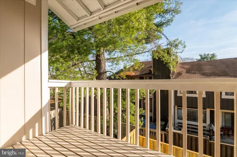 a balcony view with a garden