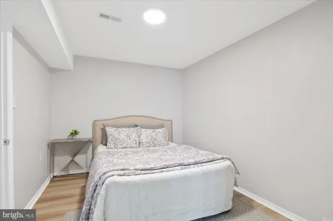 a bedroom with a bed and a table