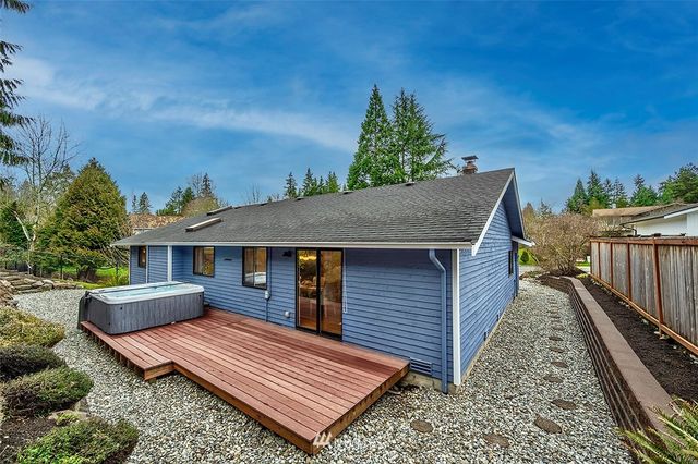 a view of a backyard with a deck