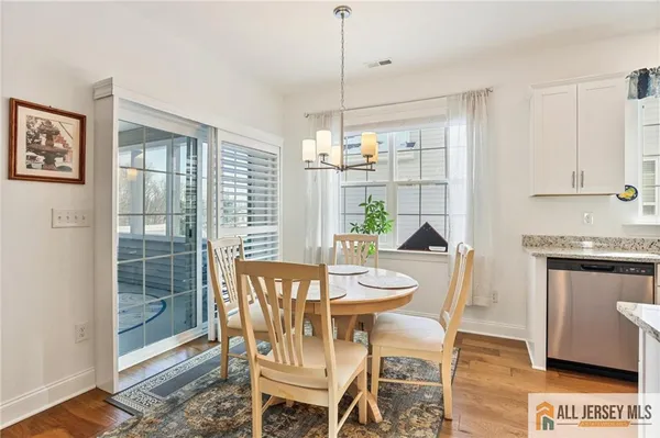 a dining room with furniture and window