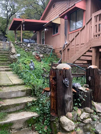 a view of a patio with table and chairs potted plants